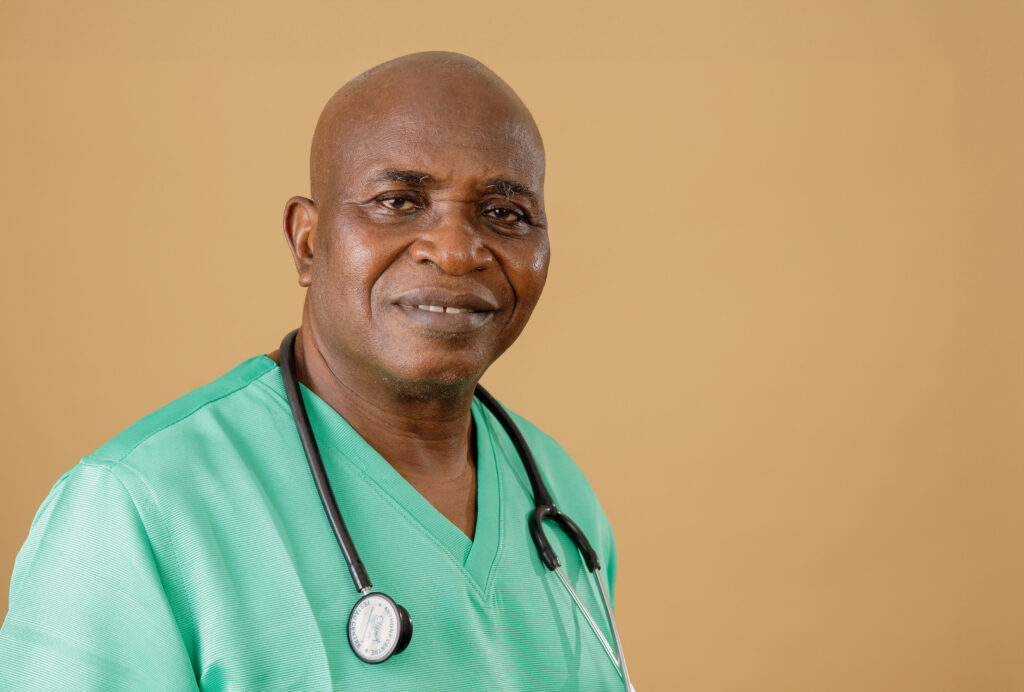 Dr Rapheal Olarewaju in scrubs